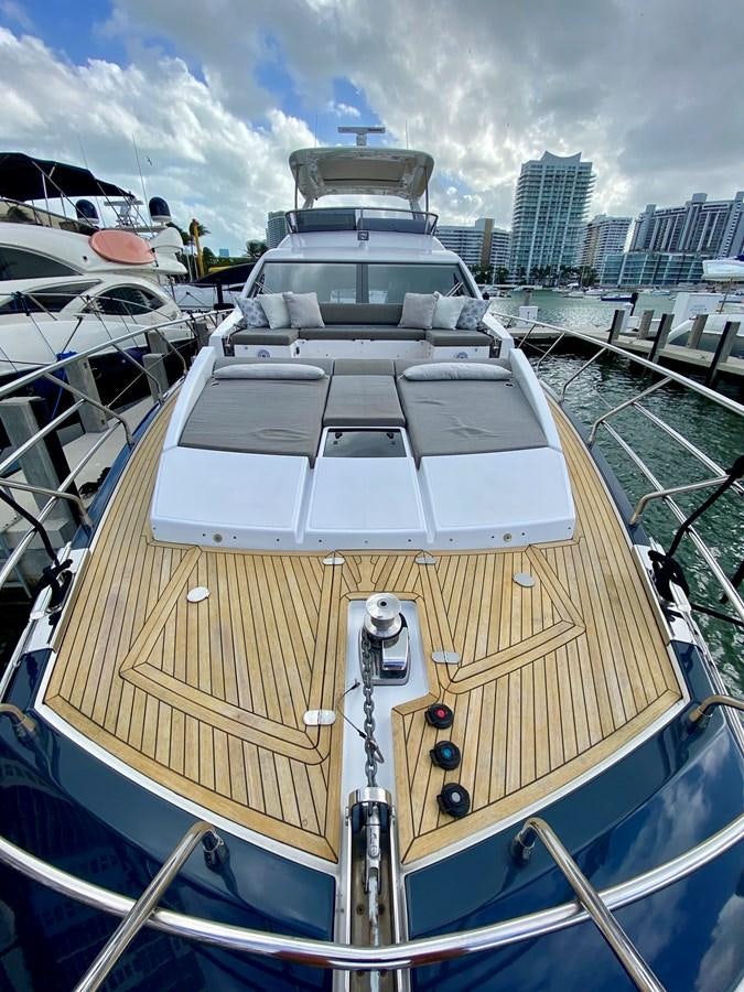 a large boat in a harbor aboard SEARENITY II Yacht for Sale