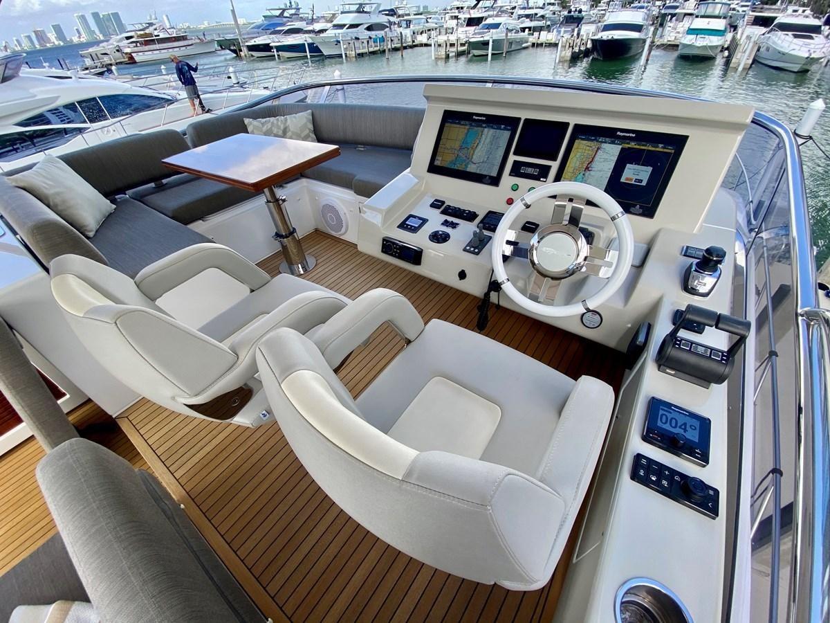 a boat with seats and tables aboard SEARENITY II Yacht for Sale