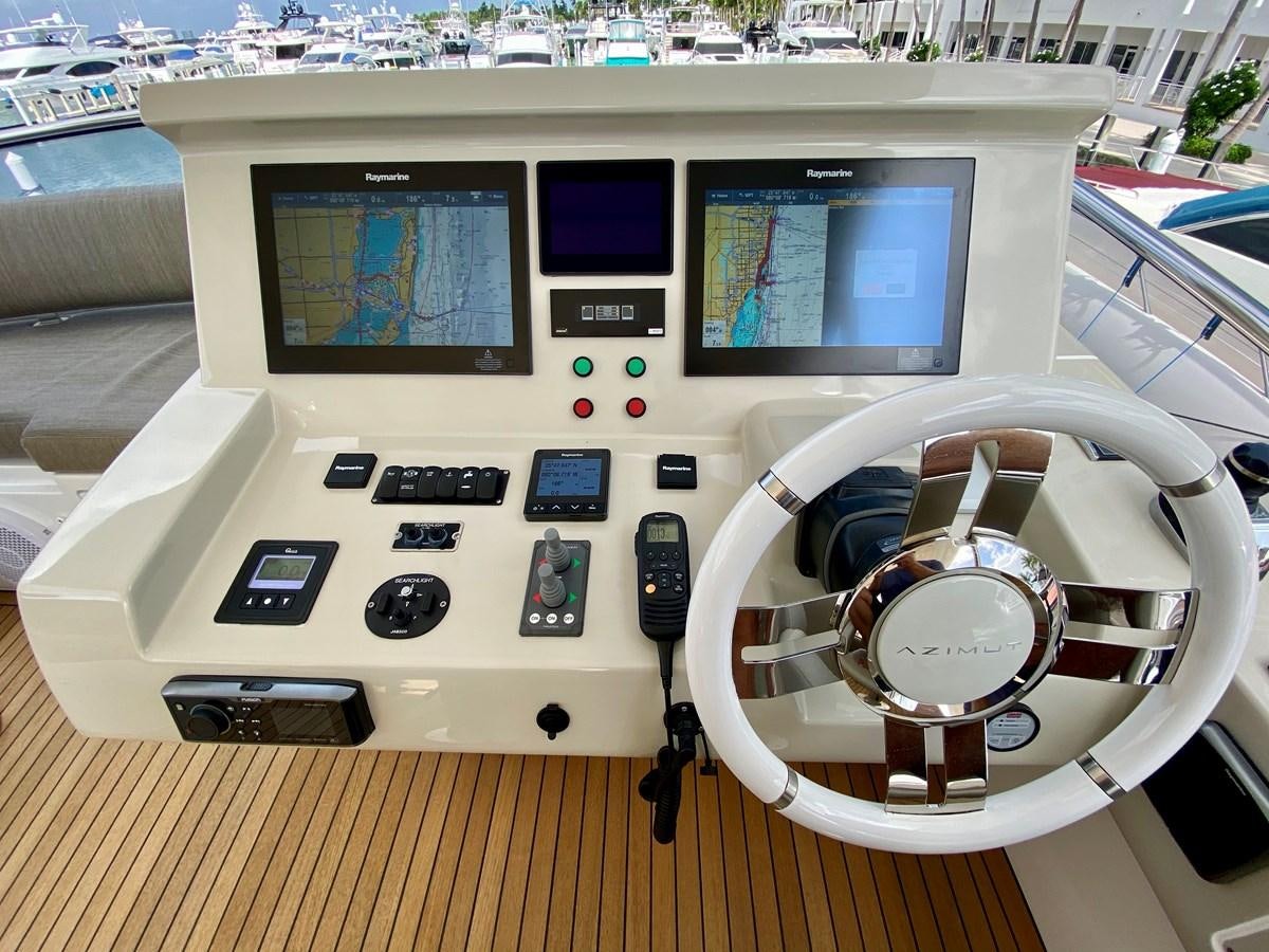 a white console with a screen and buttons and a fan on it aboard SEARENITY II Yacht for Sale