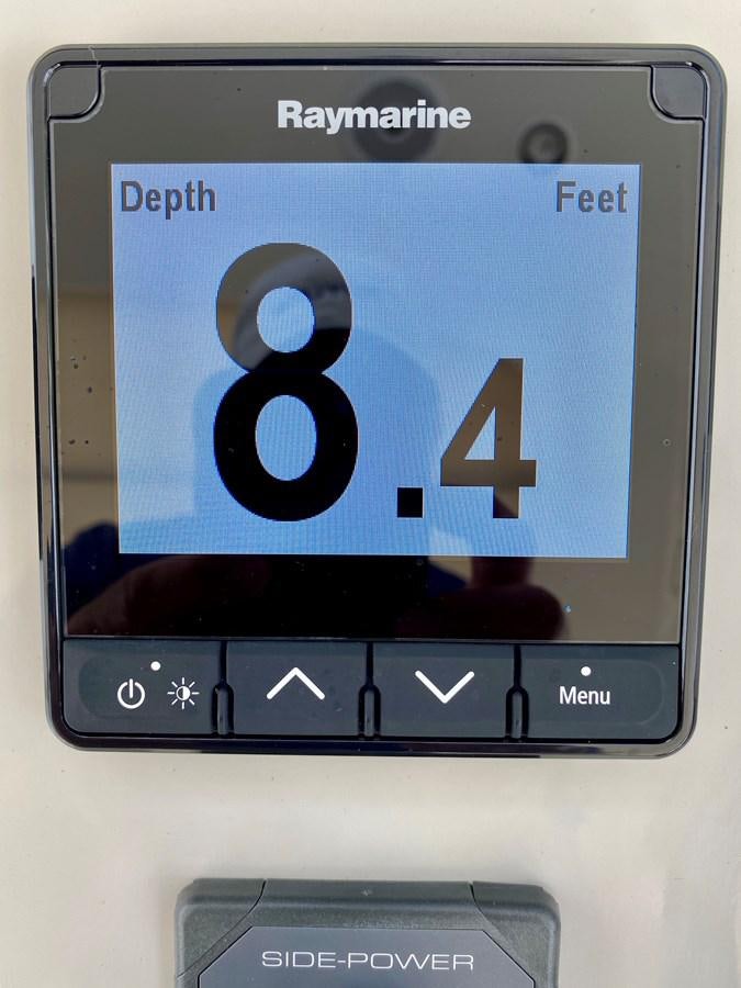 a close-up of a digital device aboard SEARENITY II Yacht for Sale