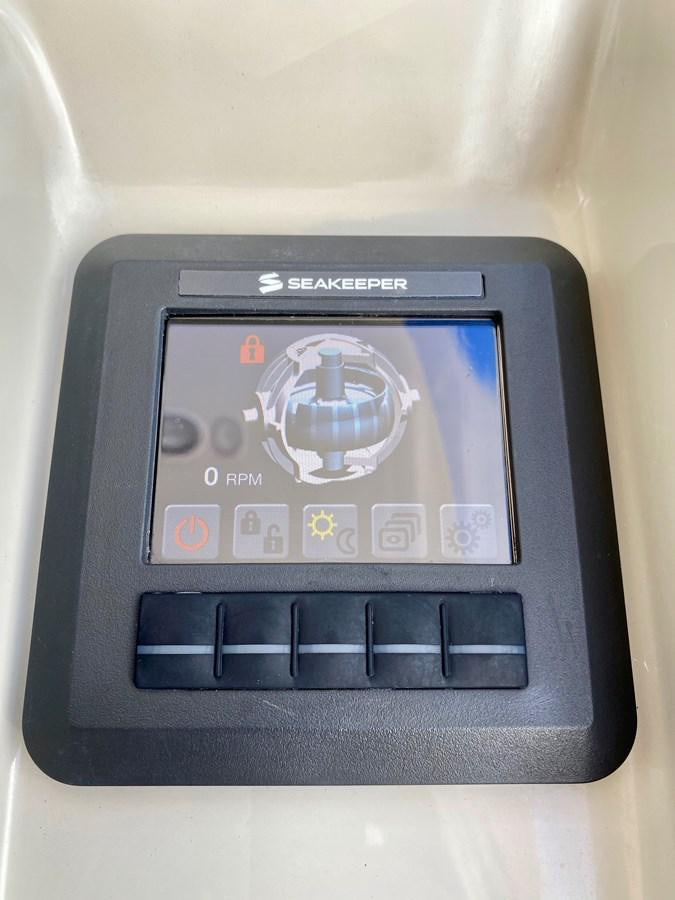 a small electronic device aboard SEARENITY II Yacht for Sale