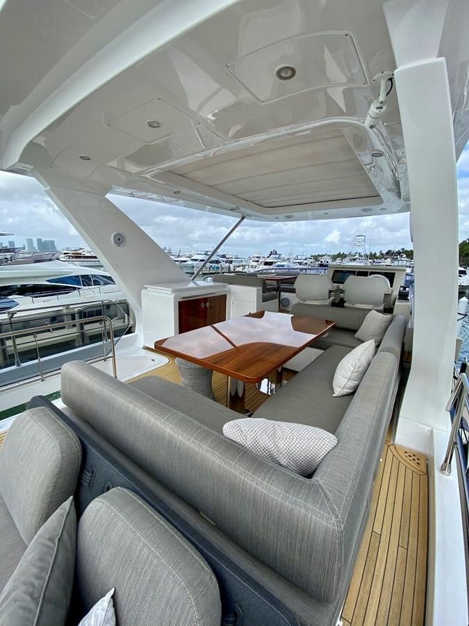 a boat with a table and chairs aboard SEARENITY II Yacht for Sale