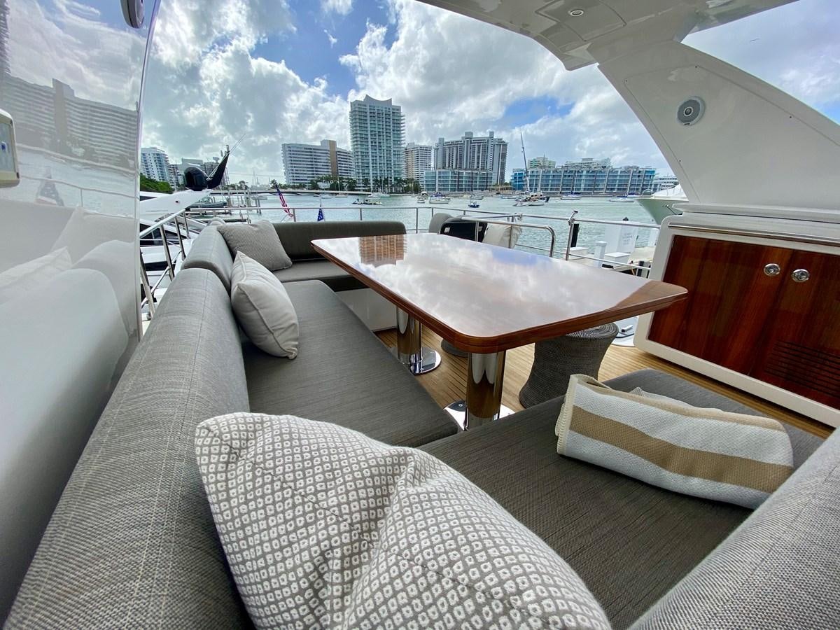 a room with a table and chairs aboard SEARENITY II Yacht for Sale