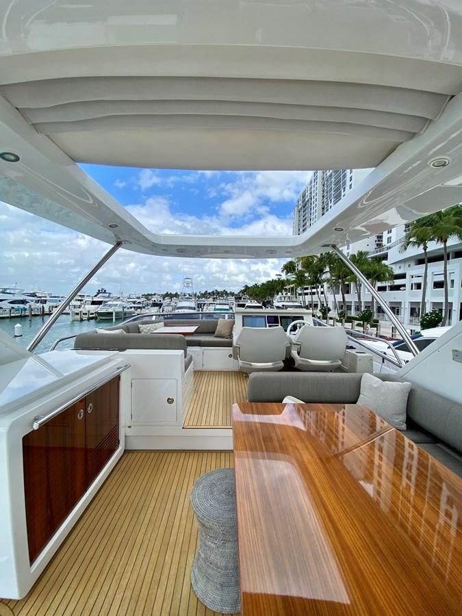 a room with a couch and a pool aboard SEARENITY II Yacht for Sale