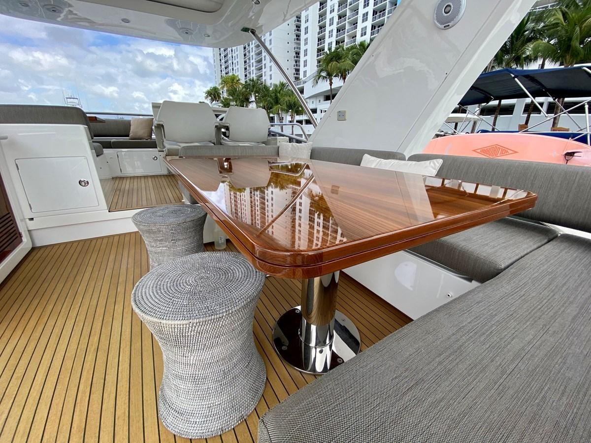 a wooden boat on a deck aboard SEARENITY II Yacht for Sale