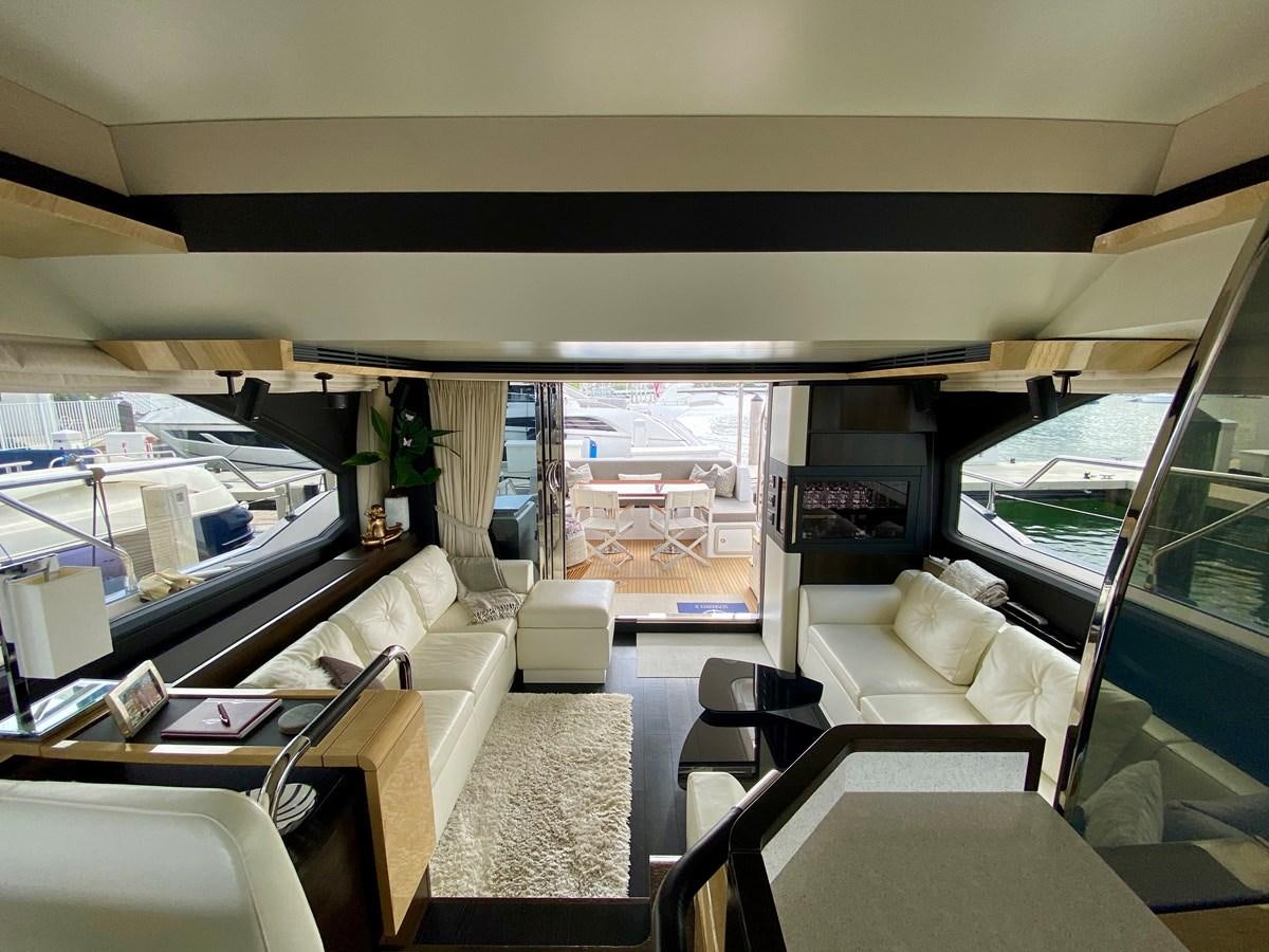 a room with a view of the water and the city aboard SEARENITY II Yacht for Sale