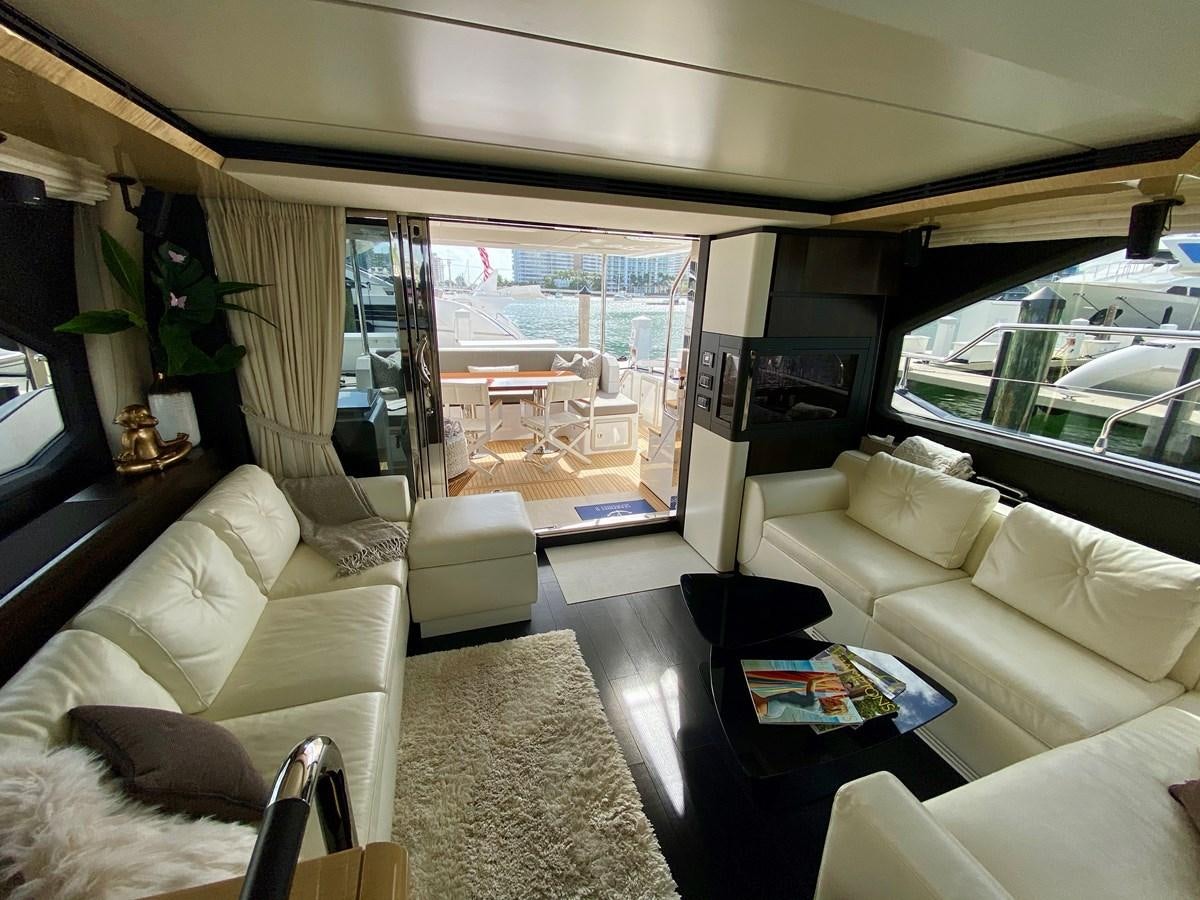 a living room with a large window aboard SEARENITY II Yacht for Sale