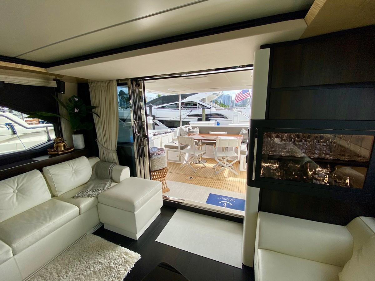 a living room with a large window aboard SEARENITY II Yacht for Sale