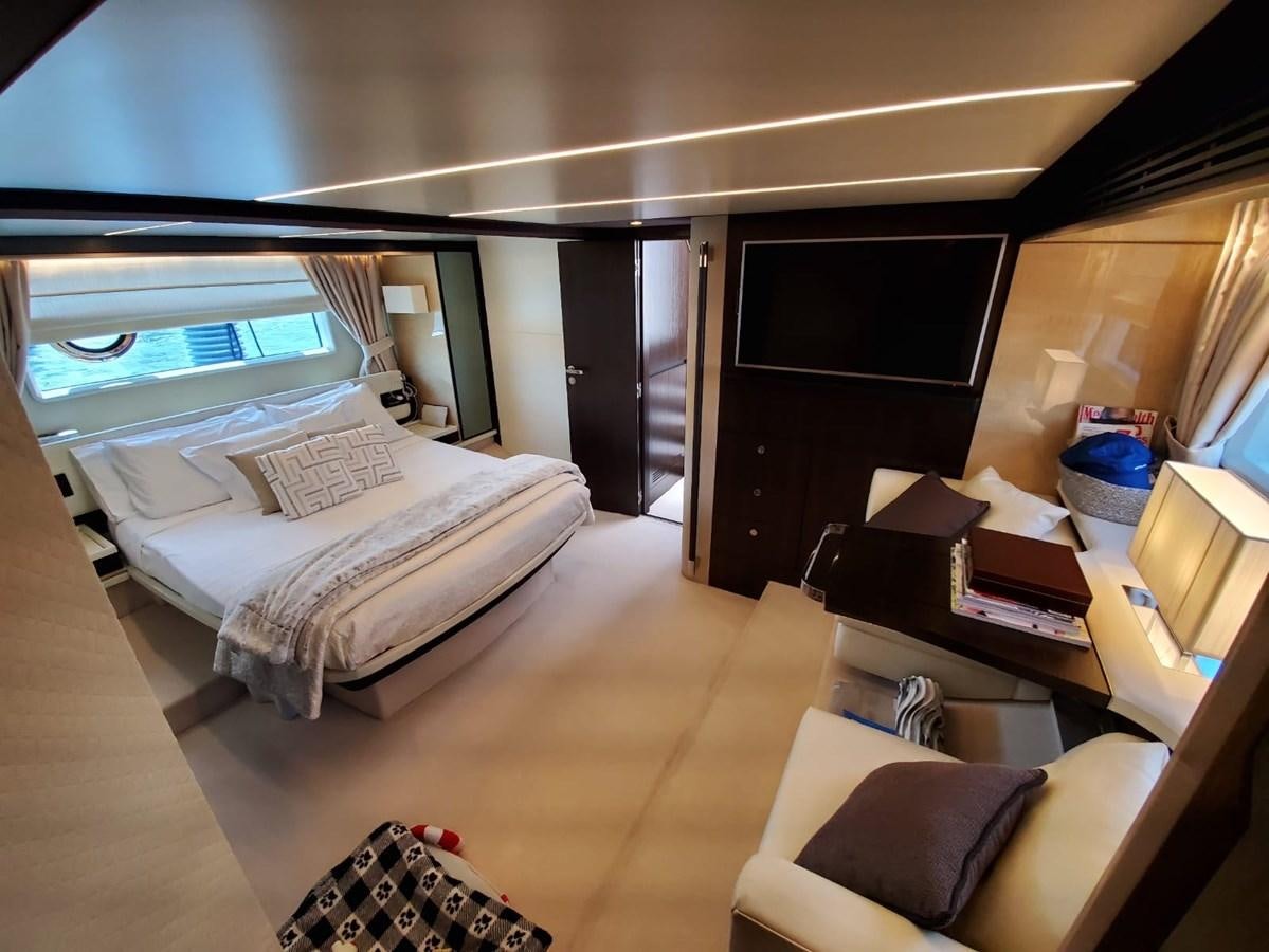 a room with a bed and a tv aboard SEARENITY II Yacht for Sale