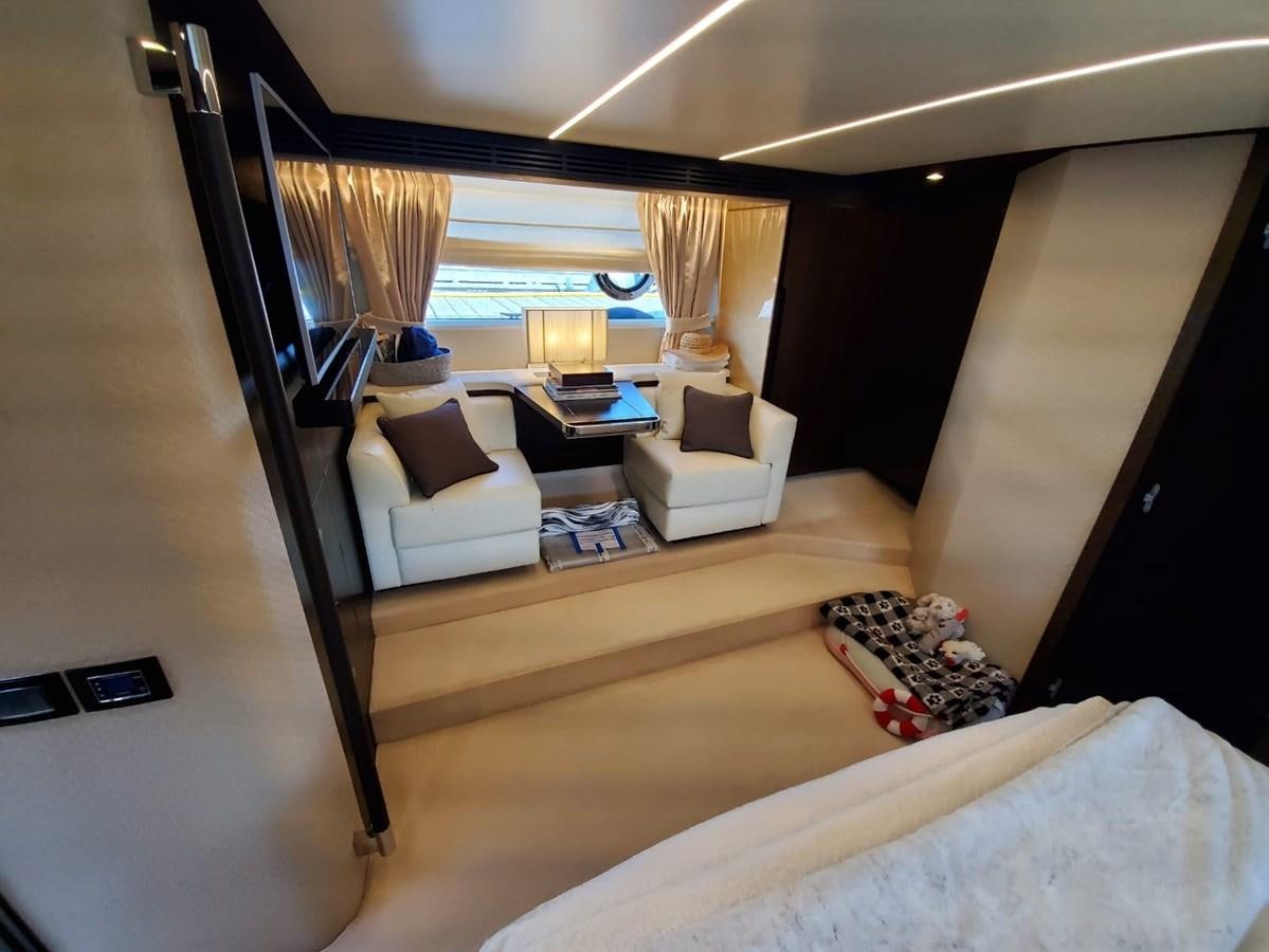 a room with a bed and a table aboard SEARENITY II Yacht for Sale