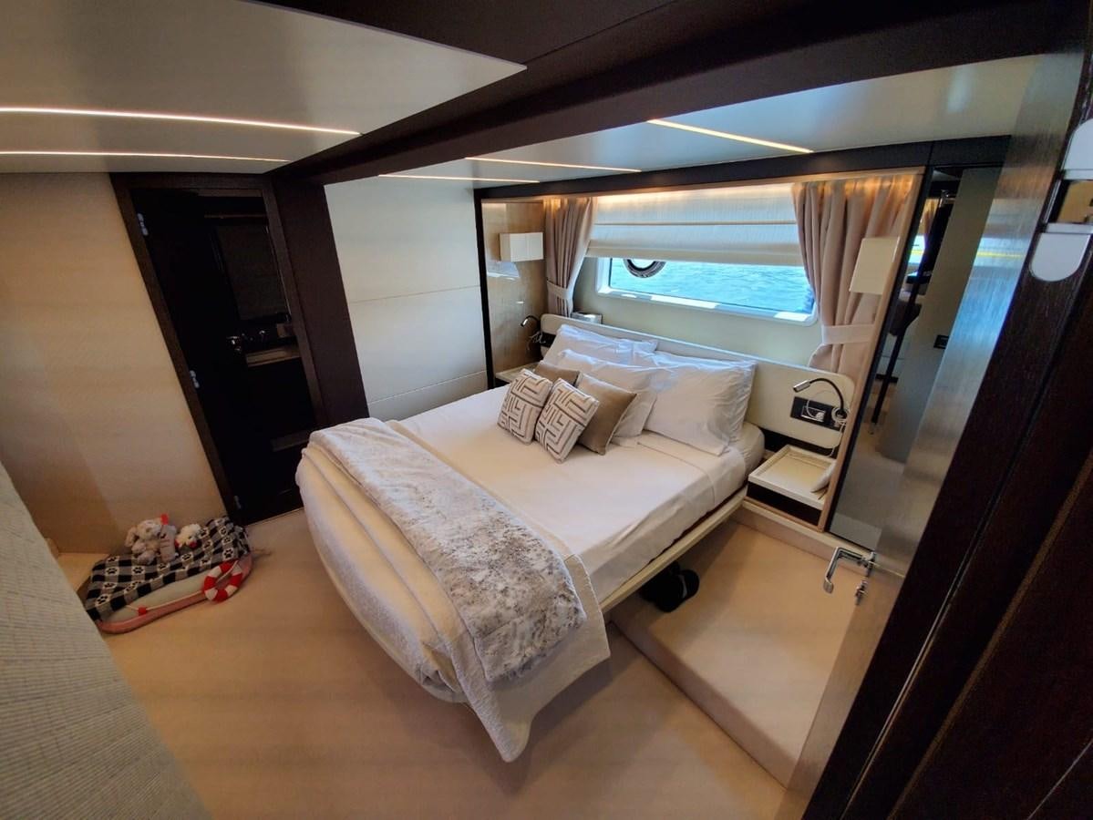 a bedroom with a large bed aboard SEARENITY II Yacht for Sale