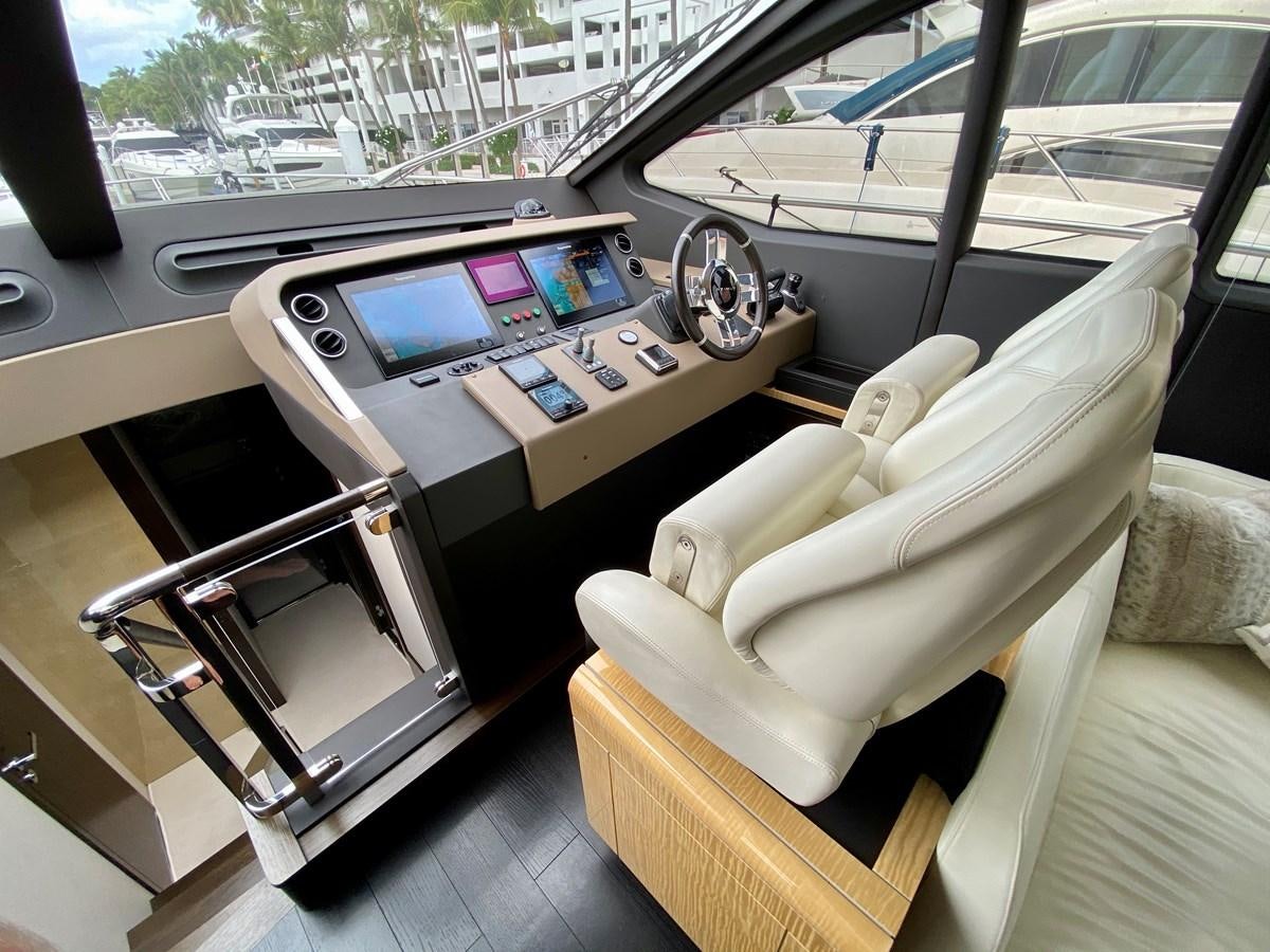 a car with a desk and a chair aboard SEARENITY II Yacht for Sale