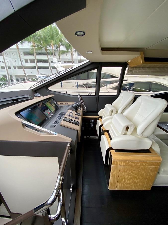 a room with a table and chairs aboard SEARENITY II Yacht for Sale