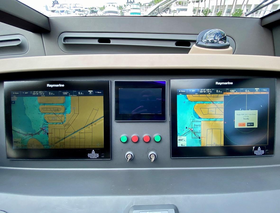 a couple of monitors on a shelf aboard SEARENITY II Yacht for Sale