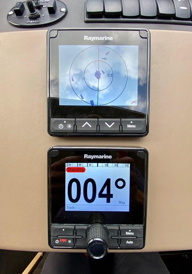 a digital clock with a digital display aboard SEARENITY II Yacht for Sale