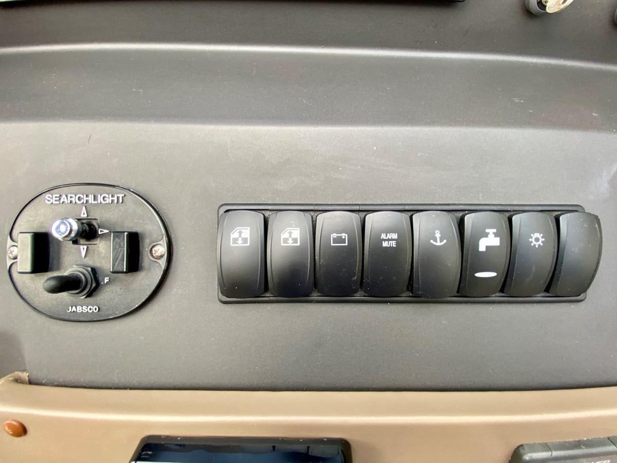 a close up of a car stereo aboard SEARENITY II Yacht for Sale