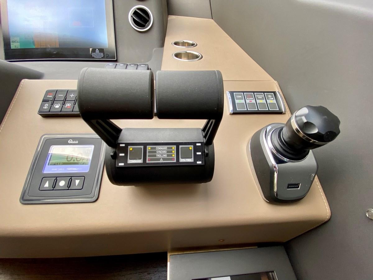 a black rectangular object with a screen and buttons on a white surface aboard SEARENITY II Yacht for Sale