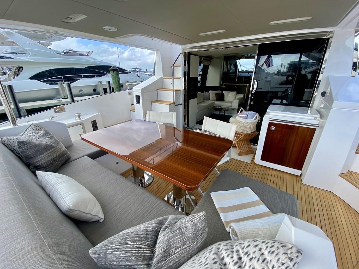 a living room with a large window aboard SEARENITY II Yacht for Sale