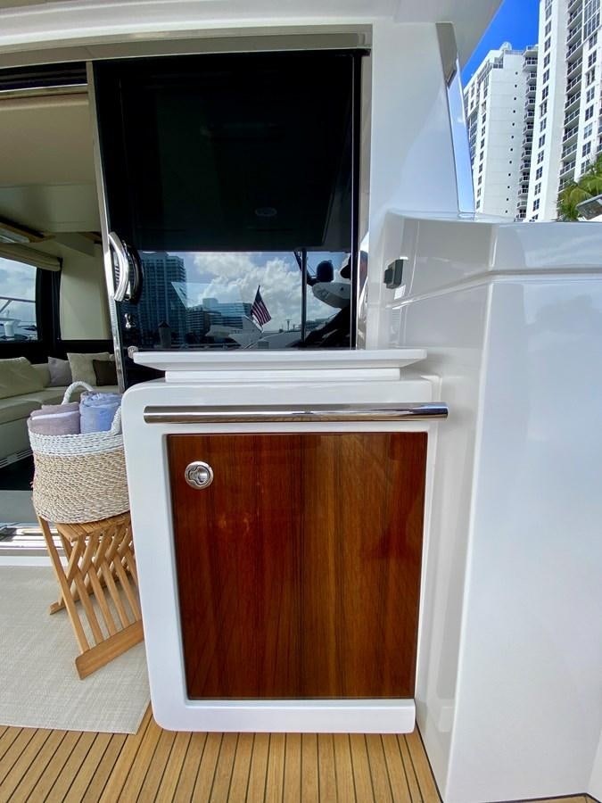 a white refrigerator in a kitchen aboard SEARENITY II Yacht for Sale