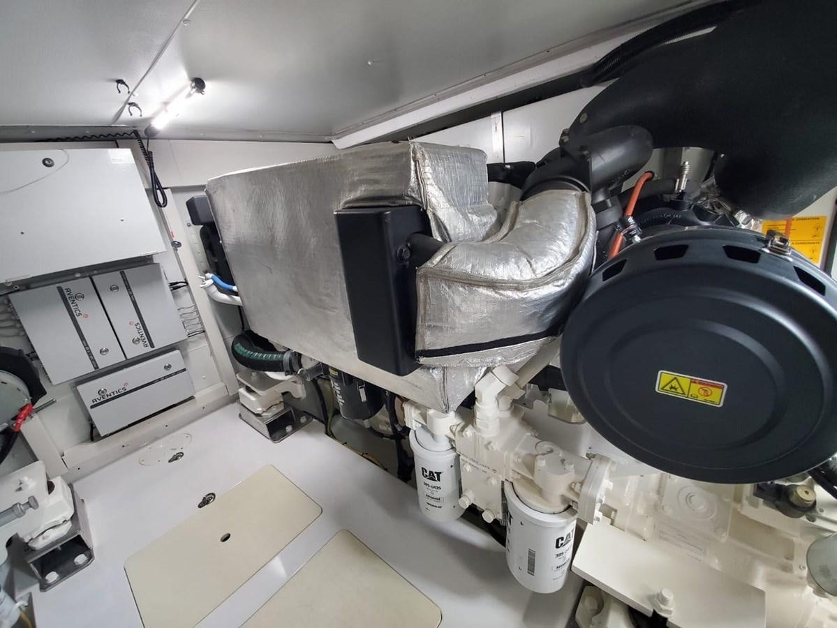 a car with a large black bucket aboard SEARENITY II Yacht for Sale