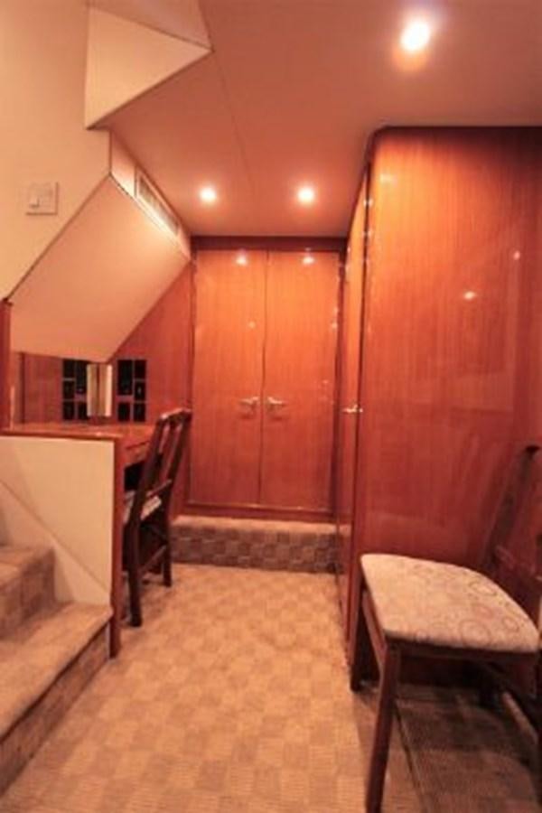 a room with wooden cabinets aboard BROKYSTONE Yacht for Sale