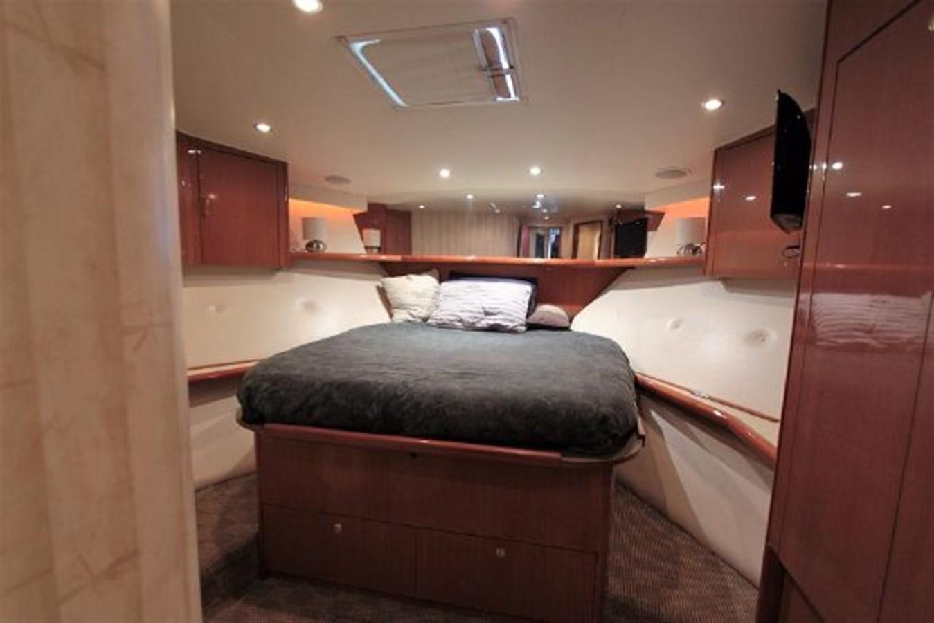 a bathroom with a bed and a bathtub aboard BROKYSTONE Yacht for Sale
