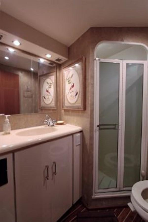a bathroom with a large mirror aboard BROKYSTONE Yacht for Sale