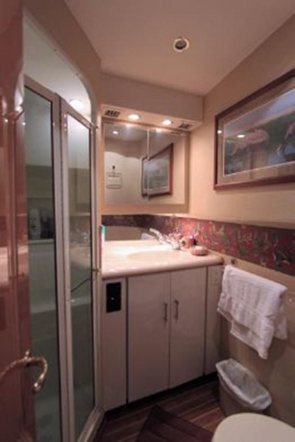 a bathroom with a sink and a mirror aboard BROKYSTONE Yacht for Sale
