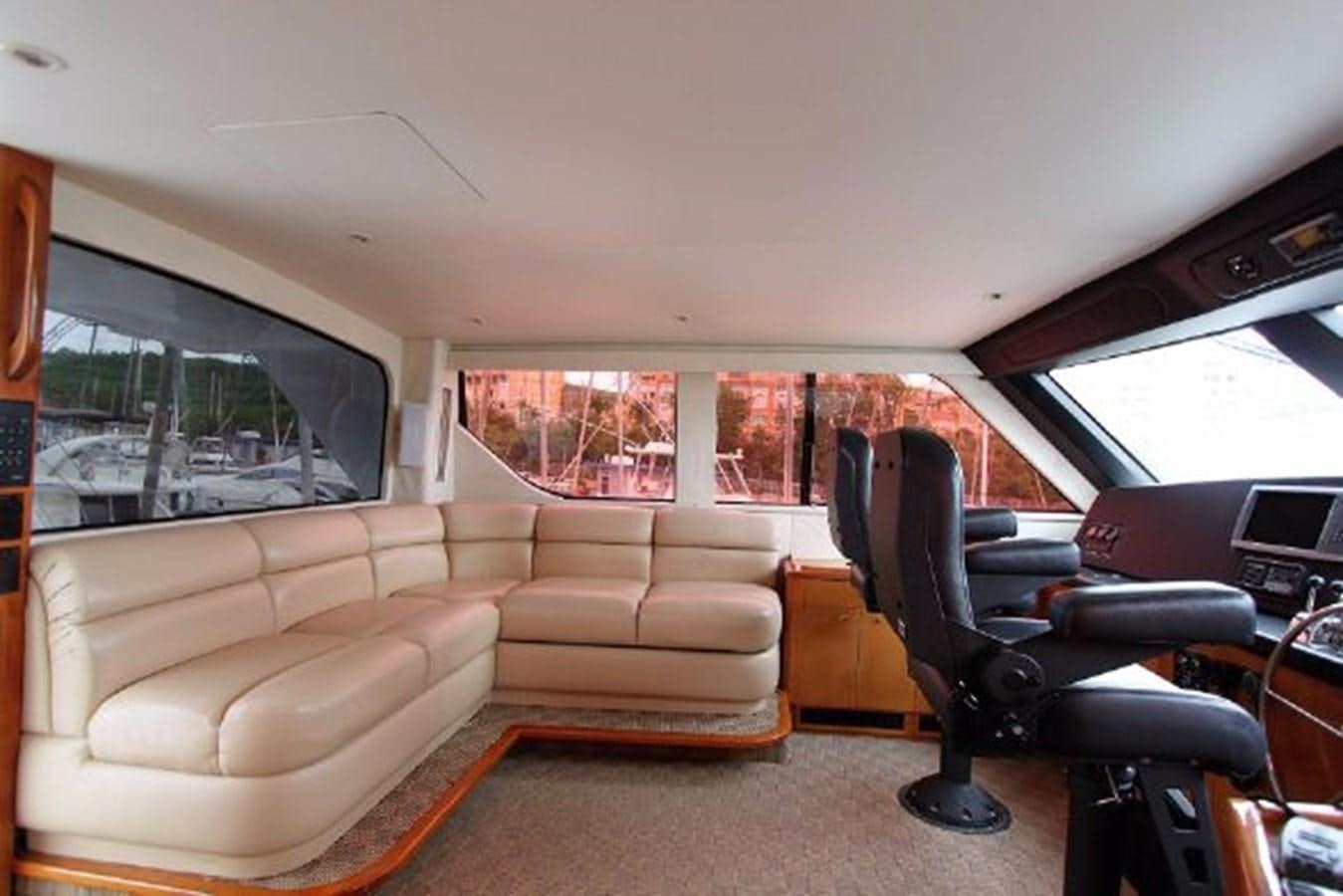 a vehicle with a seat and a couch in the front aboard BROKYSTONE Yacht for Sale
