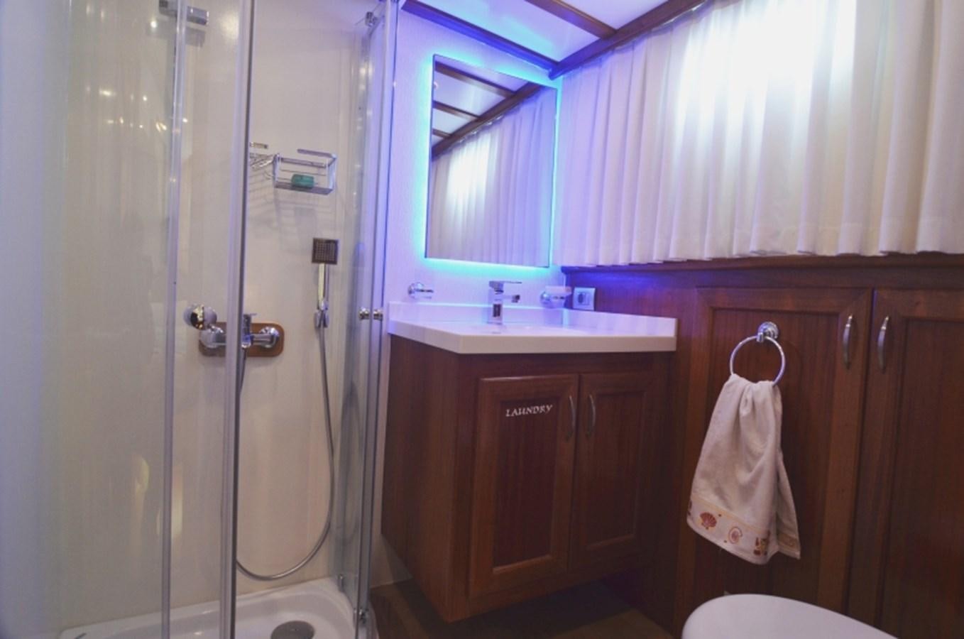 a bathroom with a glass shower aboard ZORBAS Yacht for Sale