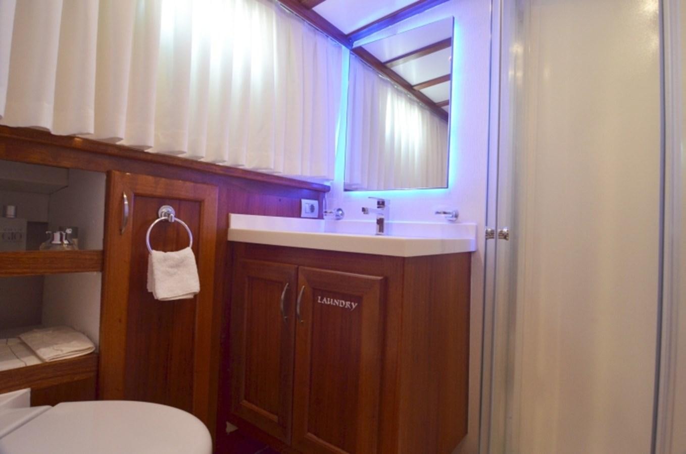 a bathroom with a sink and cabinets aboard ZORBAS Yacht for Sale