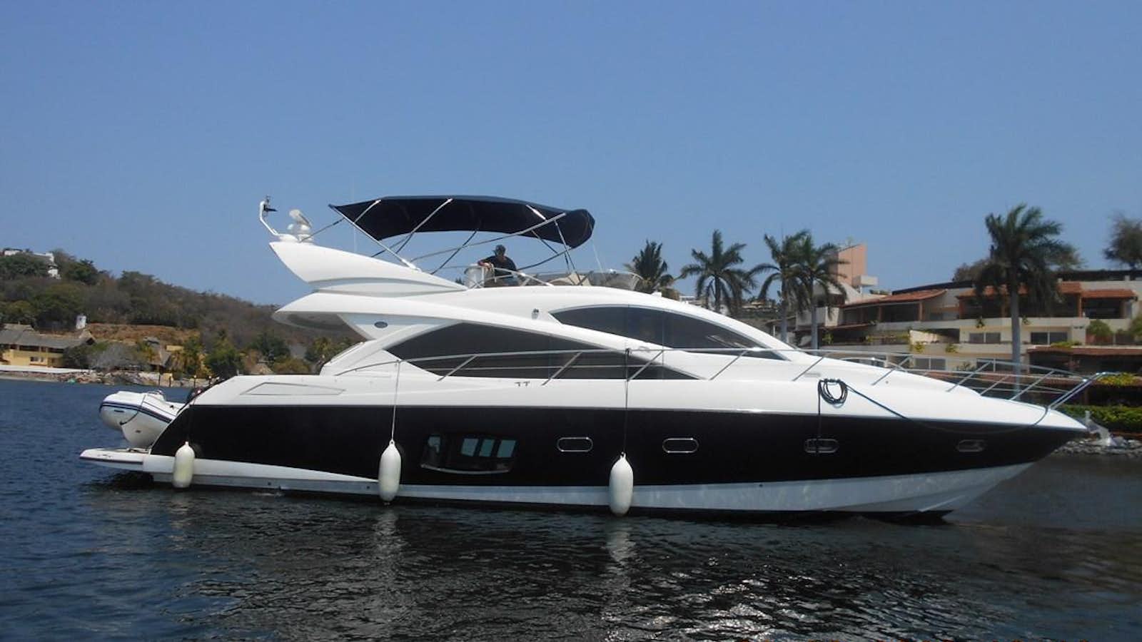 a boat on the water aboard 2011 sunseeker manhattan 60 @ ixtapa zihuatanejo Yacht for Sale