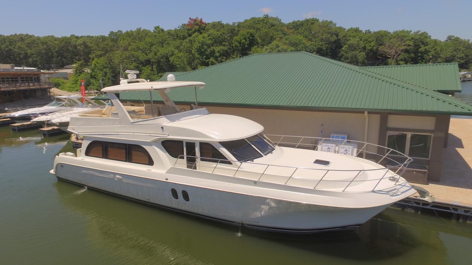 a boat docked at a pier aboard NAVIGATOR Yacht for Sale