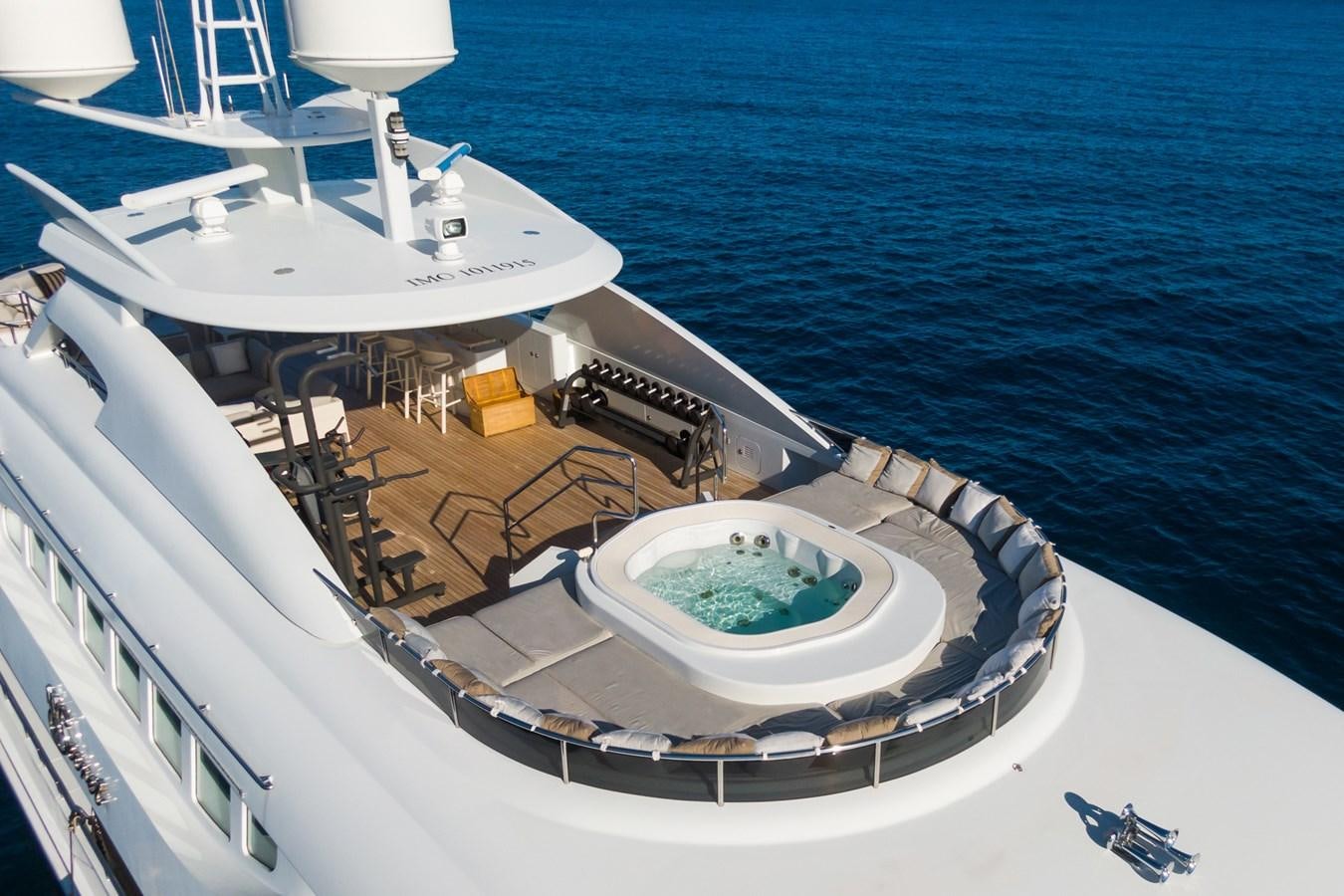 a large white ship with a round pool on the deck aboard MY SECRET Yacht for Sale