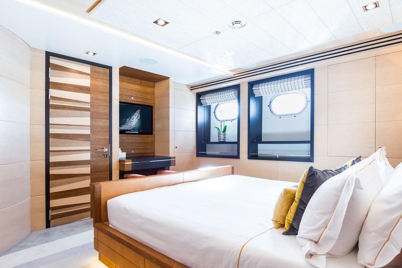 a room with a bed and a television aboard MY SECRET Yacht for Sale
