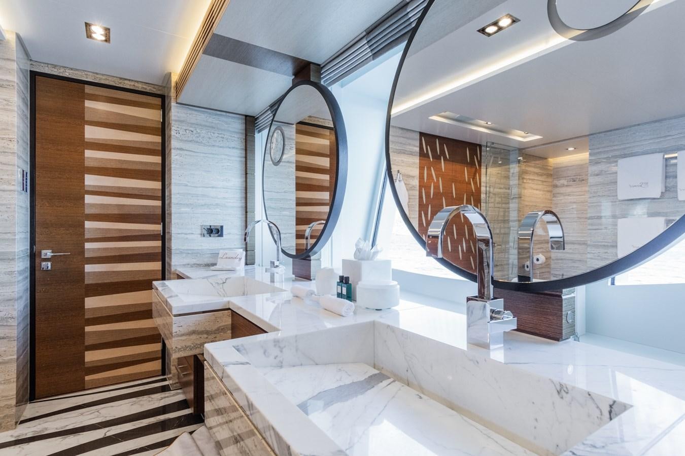 a bathroom with a large mirror aboard MY SECRET Yacht for Sale