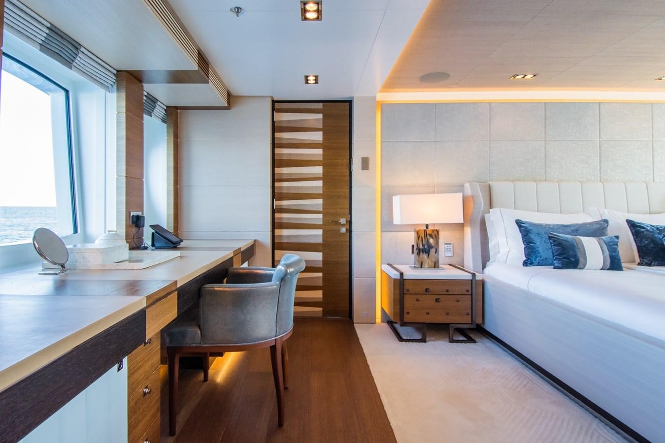 a bedroom with a desk and a bed aboard MY SECRET Yacht for Sale