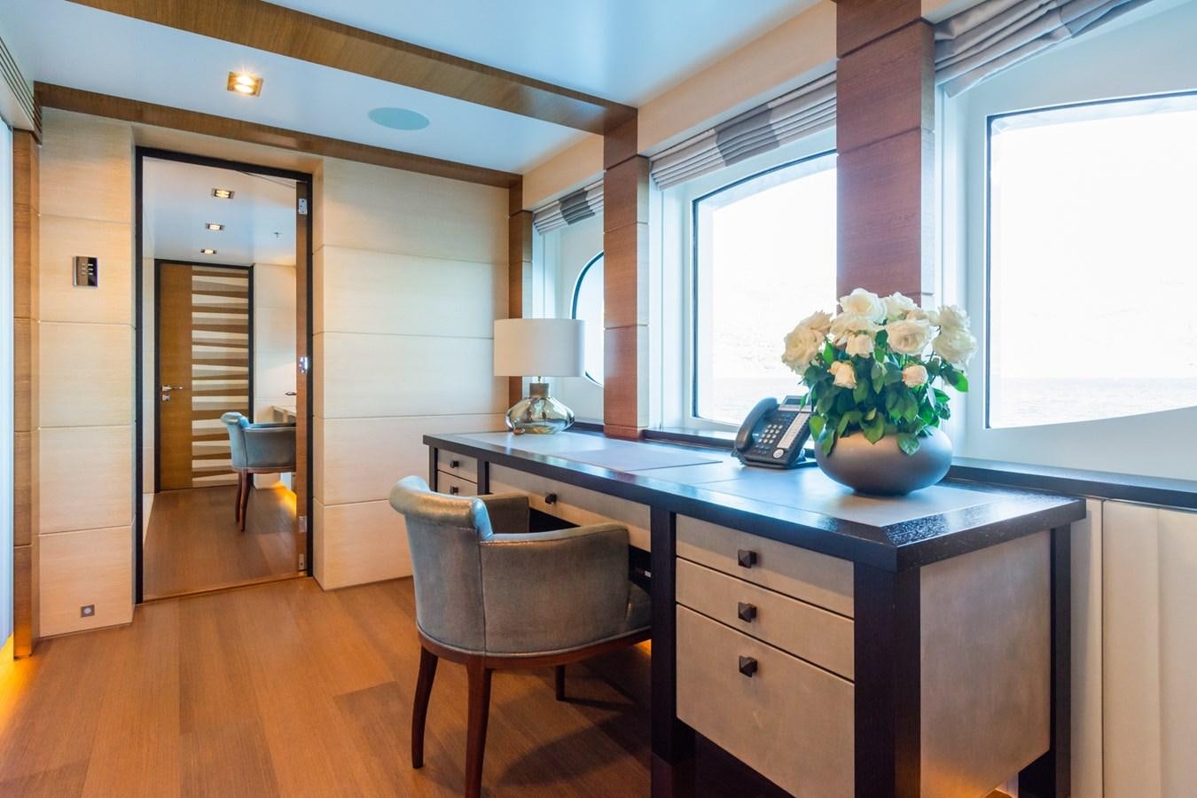 a kitchen with a table and chairs aboard MY SECRET Yacht for Sale