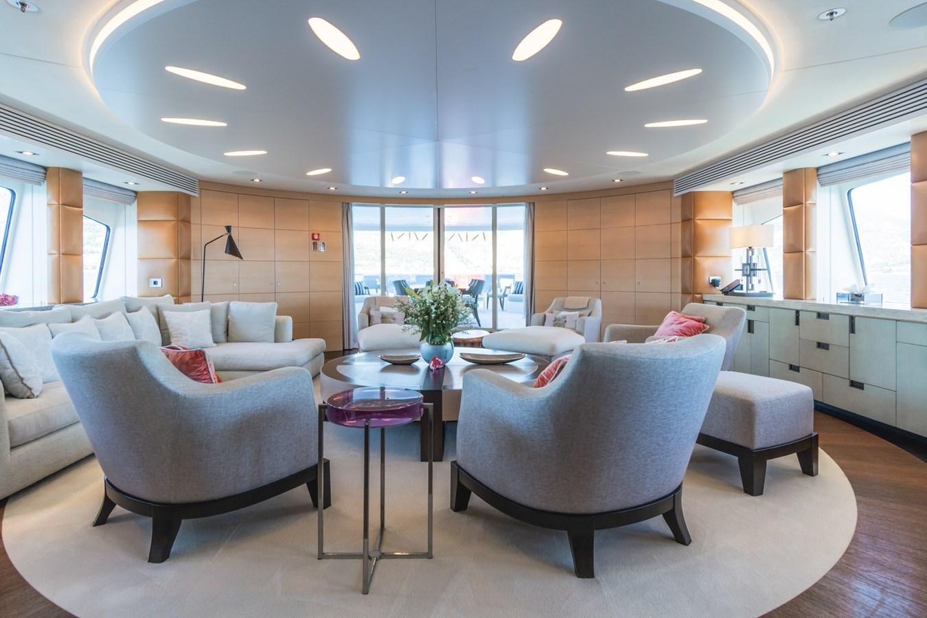 a living room with a table and chairs aboard MY SECRET Yacht for Sale