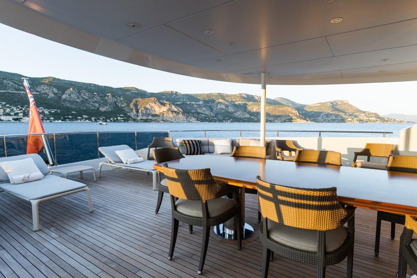 a deck with chairs and tables on it aboard MY SECRET Yacht for Sale