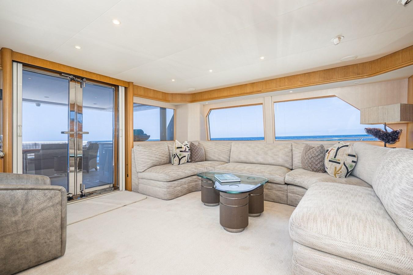a living room with a couch and a coffee table aboard ESOTERIC Yacht for Sale
