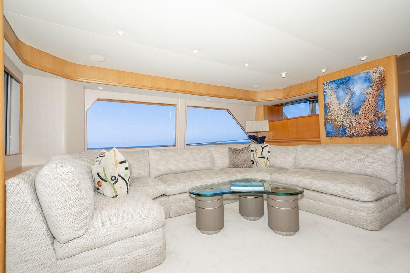 a living room with a couch and a table aboard ESOTERIC Yacht for Sale
