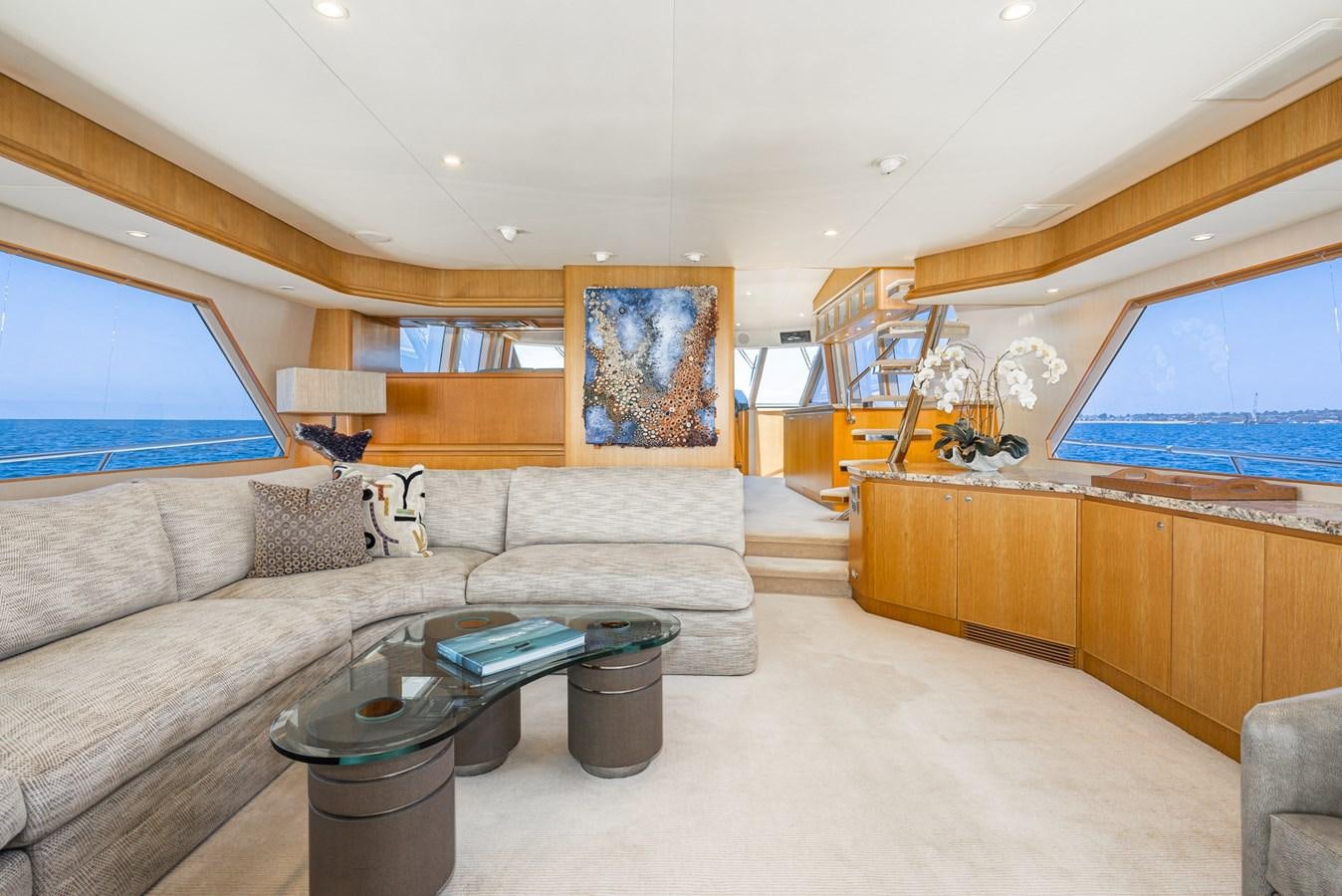 a living room with a couch and a coffee table aboard ESOTERIC Yacht for Sale