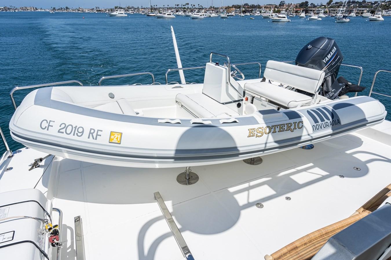 a white boat with a black cap on it aboard ESOTERIC Yacht for Sale
