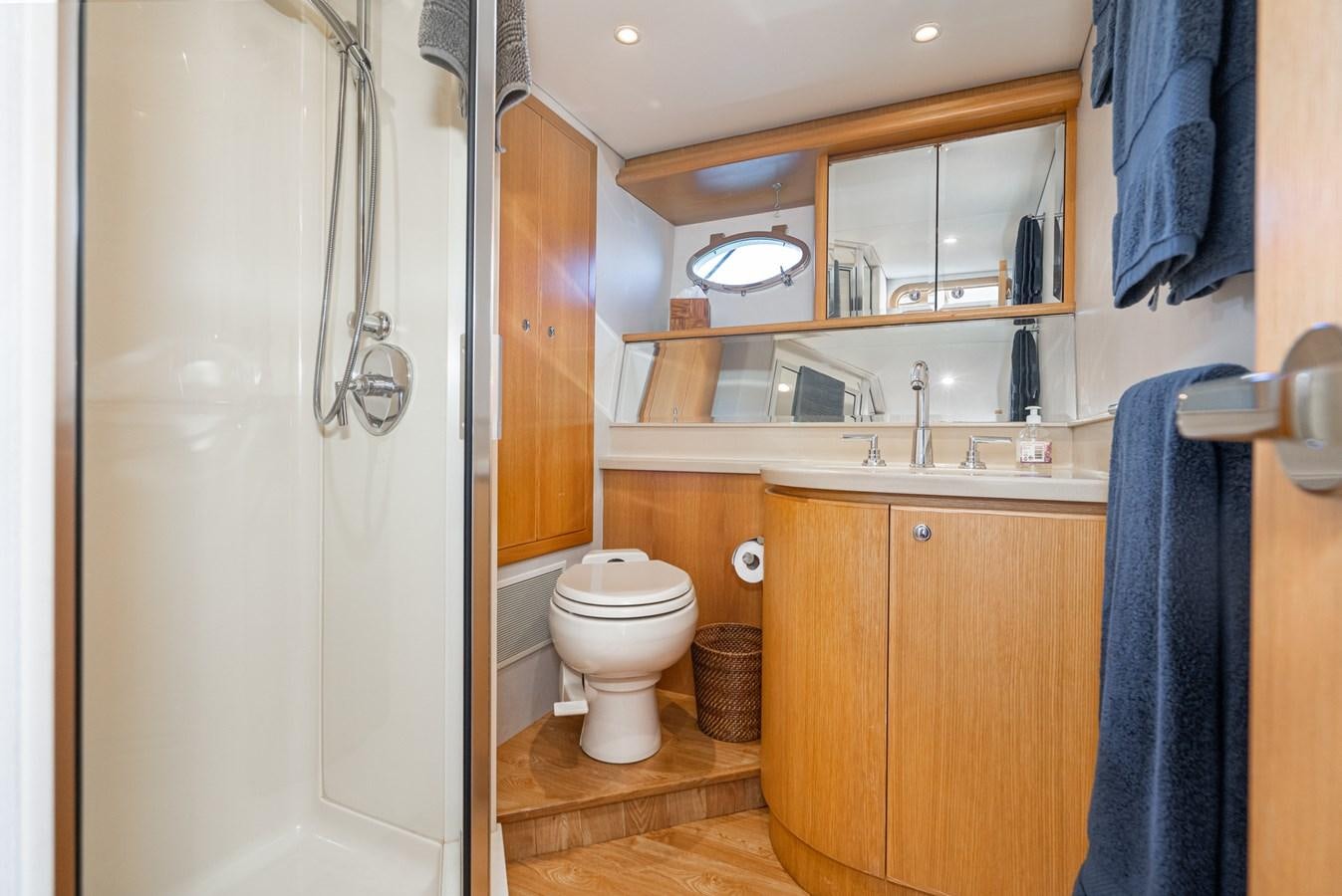 a bathroom with a toilet and sink aboard ESOTERIC Yacht for Sale