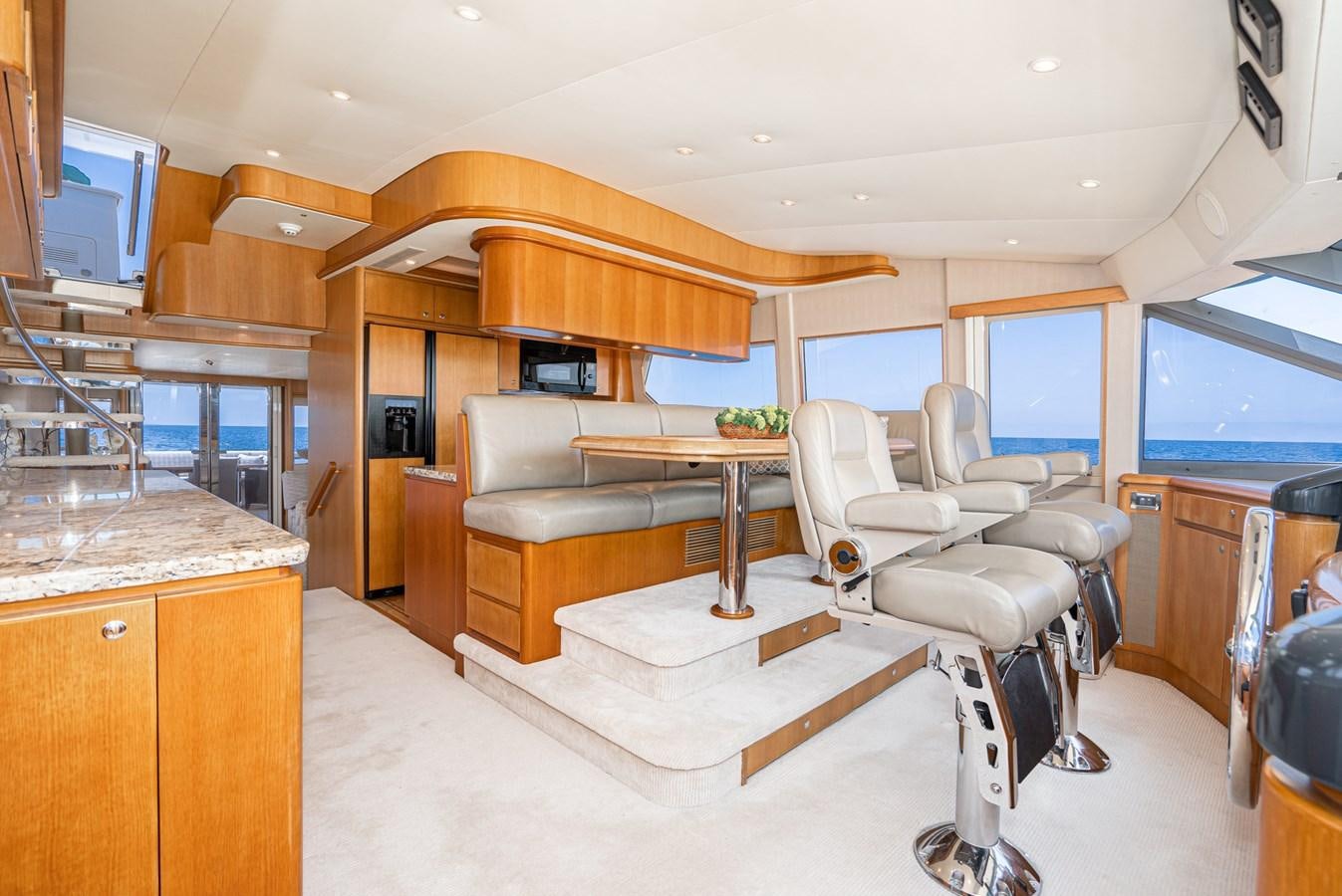 a living room with a couch and a table aboard ESOTERIC Yacht for Sale