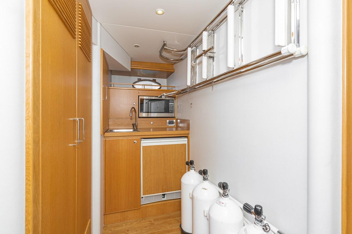 a kitchen with a sink and microwave aboard ESOTERIC Yacht for Sale