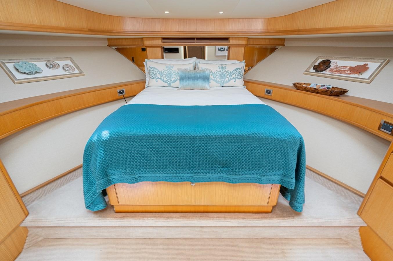 a bedroom with a bed and desk aboard ESOTERIC Yacht for Sale