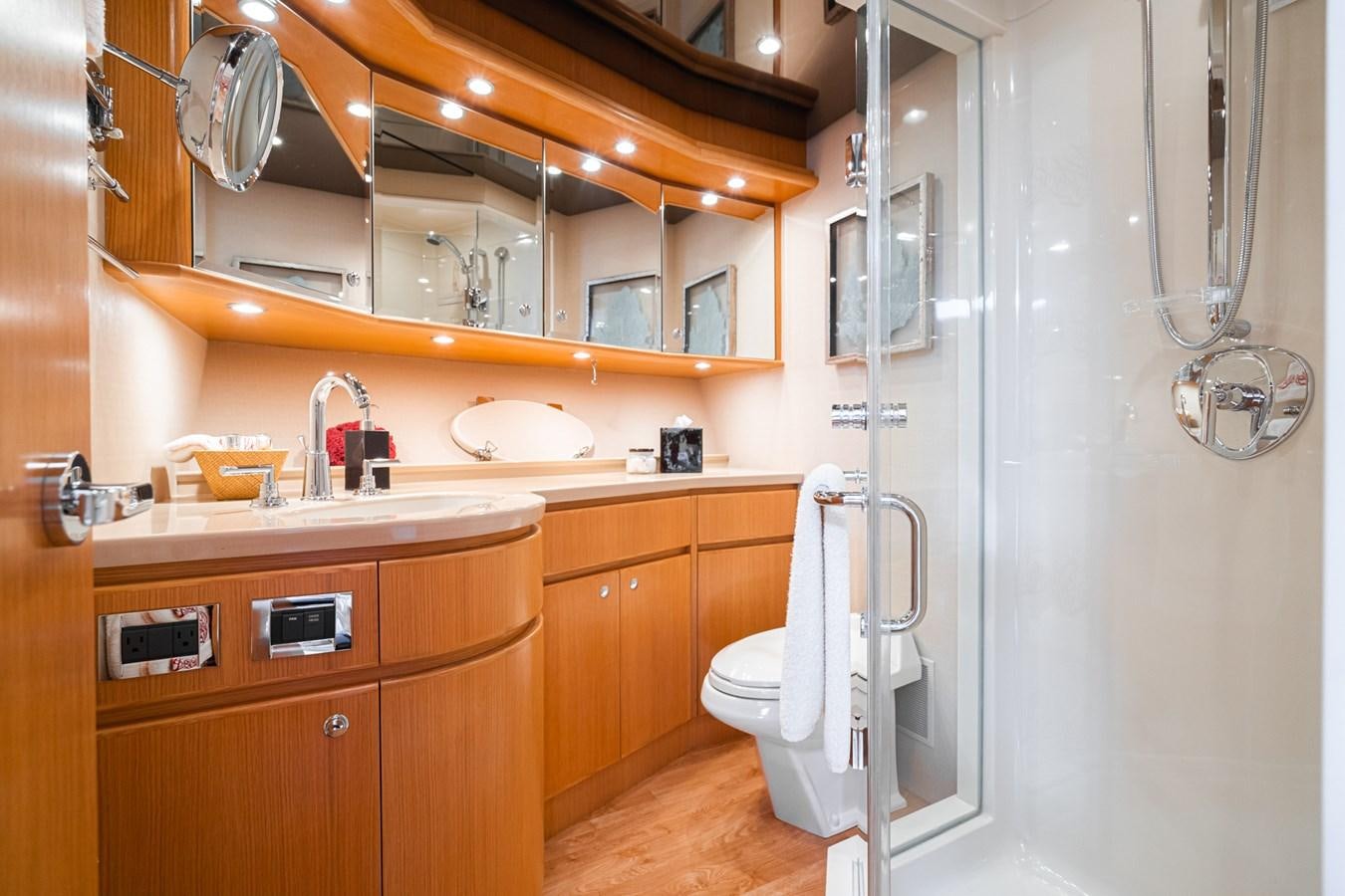 a bathroom with a large mirror aboard ESOTERIC Yacht for Sale