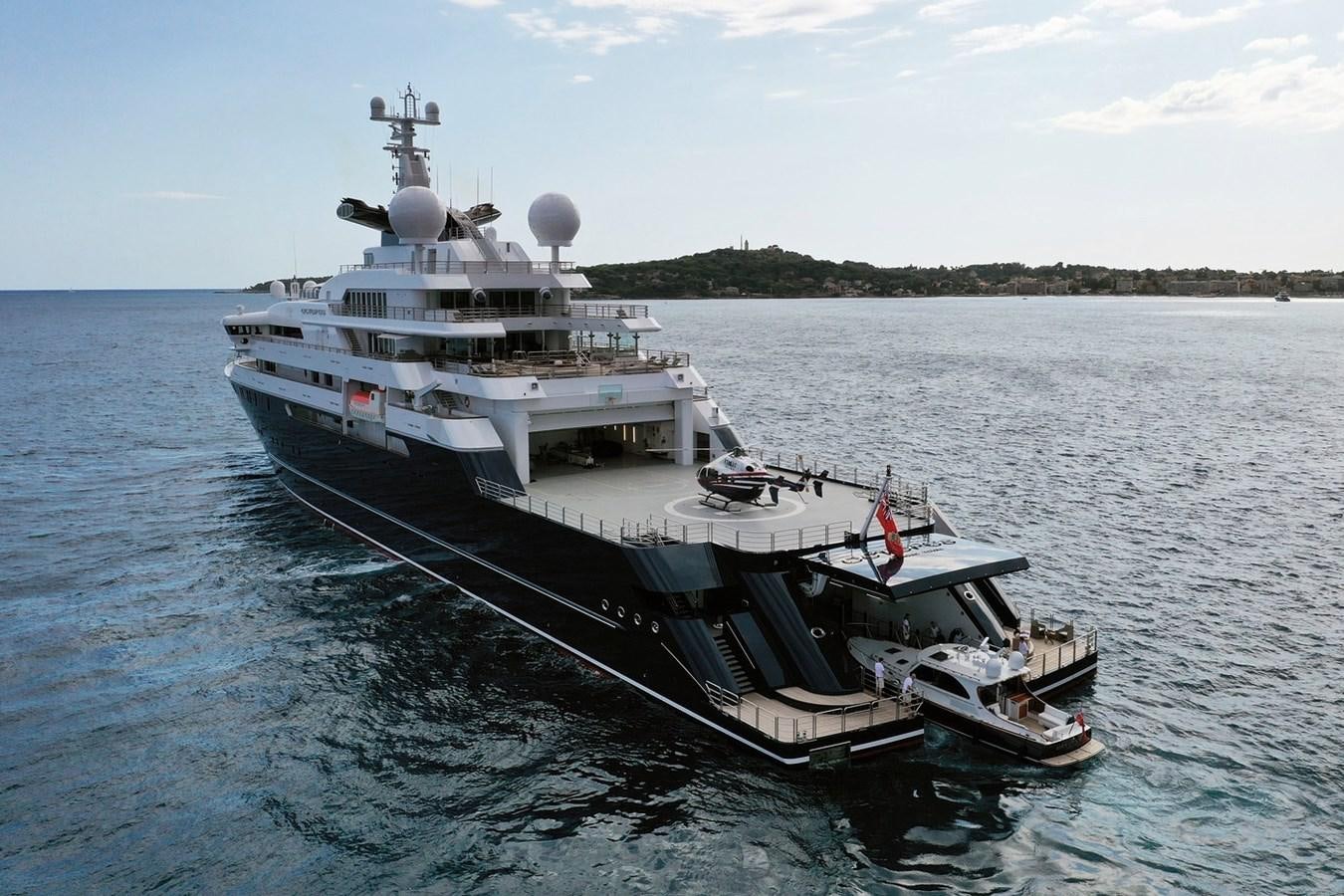 a large ship in the water aboard OCTOPUS Yacht for Sale
